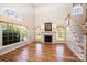 Spacious living room with hardwood floors, fireplace, and arched windows for natural light at 4047 Rainbow Hills Dr, Hickory, NC 28602