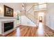 Bright and airy living room with fireplace, staircase, and beautiful hardwood flooring at 4047 Rainbow Hills Dr, Hickory, NC 28602