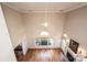 Bright living room featuring hardwood floors, a fireplace, and a large window at 4047 Rainbow Hills Dr, Hickory, NC 28602