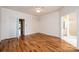 Spacious main bedroom with hardwood floors, a ceiling fan, and access to additional rooms at 4047 Rainbow Hills Dr, Hickory, NC 28602