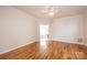 Spacious main bedroom with hardwood floors, a ceiling fan, and access to the ensuite bathroom at 4047 Rainbow Hills Dr, Hickory, NC 28602