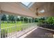 Relaxing screened porch with tiled flooring, ceiling fan and view of lush backyard and mature trees at 4047 Rainbow Hills Dr, Hickory, NC 28602