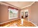 Cozy sitting room with hardwood floors, warm colors, and large windows, creating a relaxing atmosphere at 4047 Rainbow Hills Dr, Hickory, NC 28602