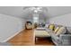 Bonus room featuring a sectional sofa, hardwood flooring, and natural light at 502 Fly Fisher Dr, Salisbury, NC 28147