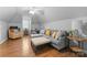 Spacious bonus room with hardwood floors, cozy seating, and ample natural light at 502 Fly Fisher Dr, Salisbury, NC 28147