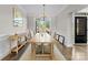 Elegant dining room with large windows, a chandelier, and a hardwood floor at 502 Fly Fisher Dr, Salisbury, NC 28147