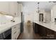 Modern kitchen with stainless appliances, an island with seating, and an adjacent dining area at 502 Fly Fisher Dr, Salisbury, NC 28147