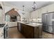 Well-appointed kitchen with an island, stainless steel appliances, and an open layout at 502 Fly Fisher Dr, Salisbury, NC 28147