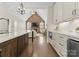 Open-concept kitchen with a large island and views of the living room with a stone fireplace at 502 Fly Fisher Dr, Salisbury, NC 28147