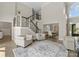 Open-concept living room boasts a staircase and bright natural light from a nearby window at 502 Fly Fisher Dr, Salisbury, NC 28147