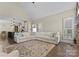 Open-concept living room seamlessly connects to the kitchen, with a large sectional sofa at 502 Fly Fisher Dr, Salisbury, NC 28147