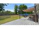Backyard with a metal pergola, an above-ground pool, and a well-manicured lawn at 5057 Sedgefield Dr, Lancaster, SC 29720