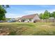 View of the backyard, featuring a patio and an above-ground pool, enclosed by a wooden fence at 5057 Sedgefield Dr, Lancaster, SC 29720