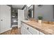 Bathroom featuring single vanity, neutral countertops, and storage shelving at 5057 Sedgefield Dr, Lancaster, SC 29720