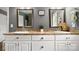 Bathroom featuring double sinks, neutral countertops, and decorative wall decor at 5057 Sedgefield Dr, Lancaster, SC 29720