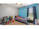bedroom with a bed, toy storage, carpet flooring, and a dark curtain covering the window at 5057 Sedgefield Dr, Lancaster, SC 29720