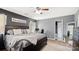 Bedroom with a workstation, a ceiling fan, carpet, and a large bed with throw pillows and blankets at 5057 Sedgefield Dr, Lancaster, SC 29720