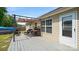 Deck with a dark metal pergola with seating and views of the backyard at 5057 Sedgefield Dr, Lancaster, SC 29720