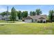 Inviting single-story home featuring a spacious front yard and attached two-car garage at 5057 Sedgefield Dr, Lancaster, SC 29720