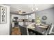 Cozy kitchen with white cabinets, stainless steel appliances, and a dining table at 5057 Sedgefield Dr, Lancaster, SC 29720