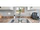Close-up on kitchen sink and window with stainless steel faucet, and modern air fryer at 5057 Sedgefield Dr, Lancaster, SC 29720