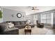 Inviting living room featuring a sectional sofa, wood floors, ceiling fan, and neutral tones at 5057 Sedgefield Dr, Lancaster, SC 29720