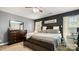 Serene main bedroom featuring a large bed, dark accent wall, and soft lighting at 5057 Sedgefield Dr, Lancaster, SC 29720