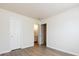 Neutral bedroom with vinyl flooring and an open door to an ensuite bathroom at 521 Ellingsworth Ln, Charlotte, NC 28214