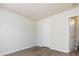 Bright, neutral bedroom with vinyl flooring and access to an ensuite bathroom at 521 Ellingsworth Ln, Charlotte, NC 28214
