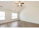 Bright, airy bedroom with vaulted ceilings, wood-look floors, and large windows at 521 Ellingsworth Ln, Charlotte, NC 28214