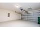 Spacious garage with a pristine white floor offers ample storage space and convenient access to your vehicles at 521 Ellingsworth Ln, Charlotte, NC 28214