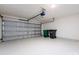 Spacious two car garage with finished walls and floor, and an automatic door opener at 521 Ellingsworth Ln, Charlotte, NC 28214
