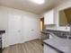 Efficient kitchen features stainless steel appliances, gray countertops, and white cabinetry, offering ample storage space at 521 Ellingsworth Ln, Charlotte, NC 28214