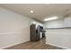 Open-concept kitchen with stainless steel appliances and ample counter space at 521 Ellingsworth Ln, Charlotte, NC 28214