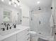 Elegant bathroom with a glass-enclosed shower, modern vanity, and stylish finishes at 5219 Farmbrook Dr, Charlotte, NC 28210