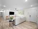 Bright living room featuring modern decor, ample natural light, and open space perfect for relaxing and entertaining guests at 5219 Farmbrook Dr, Charlotte, NC 28210