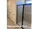 Sleek bathroom featuring a modern glass-enclosed shower and multiple storage closets for organization at 6209 Busch Way, Midland, NC 28107