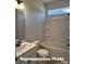 Cozy bathroom with a tub/shower combo, sink, and a framed mirror with modern lighting at 6209 Busch Way, Midland, NC 28107