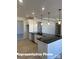 Modern kitchen featuring black countertops, and a sleek sink that enhances the space's modern look at 6209 Busch Way, Midland, NC 28107