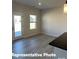 Bright kitchenette featuring wood-look floors, and a door leading to the exterior of the home at 6209 Busch Way, Midland, NC 28107