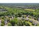 Beautiful aerial view of neighborhood with mature tree coverage, solar panels and well manicured lawns at 6724 Long Nook Ln, Indian Trail, NC 28079