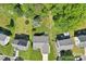 An aerial view captures the property with a spacious backyard, mature trees, and a trampoline at 6724 Long Nook Ln, Indian Trail, NC 28079