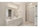 Bathroom with a double vanity, a large mirror, and a separate shower stall at 6724 Long Nook Ln, Indian Trail, NC 28079