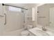 Well-lit bathroom showcasing a shower-tub combo, vanity with sink, and a medicine cabinet at 6724 Long Nook Ln, Indian Trail, NC 28079