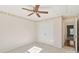 Cozy bedroom featuring neutral walls, a ceiling fan, closet, and doorway leading to another room at 6724 Long Nook Ln, Indian Trail, NC 28079