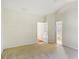 Spacious bedroom with a view to an ensuite bathroom and a hallway with hardwood flooring at 6724 Long Nook Ln, Indian Trail, NC 28079