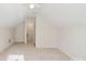 Spacious bonus room with neutral walls, a ceiling fan, and a doorway at 6724 Long Nook Ln, Indian Trail, NC 28079