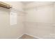 Walk-in closet with multiple shelves for organized storage, ready for your personalization at 6724 Long Nook Ln, Indian Trail, NC 28079