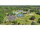 Aerial view showcases the community amenities including a pool, tennis courts, and pond at 6724 Long Nook Ln, Indian Trail, NC 28079