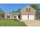 Charming two-story brick home with a well-manicured lawn and two-car garage at 6724 Long Nook Ln, Indian Trail, NC 28079